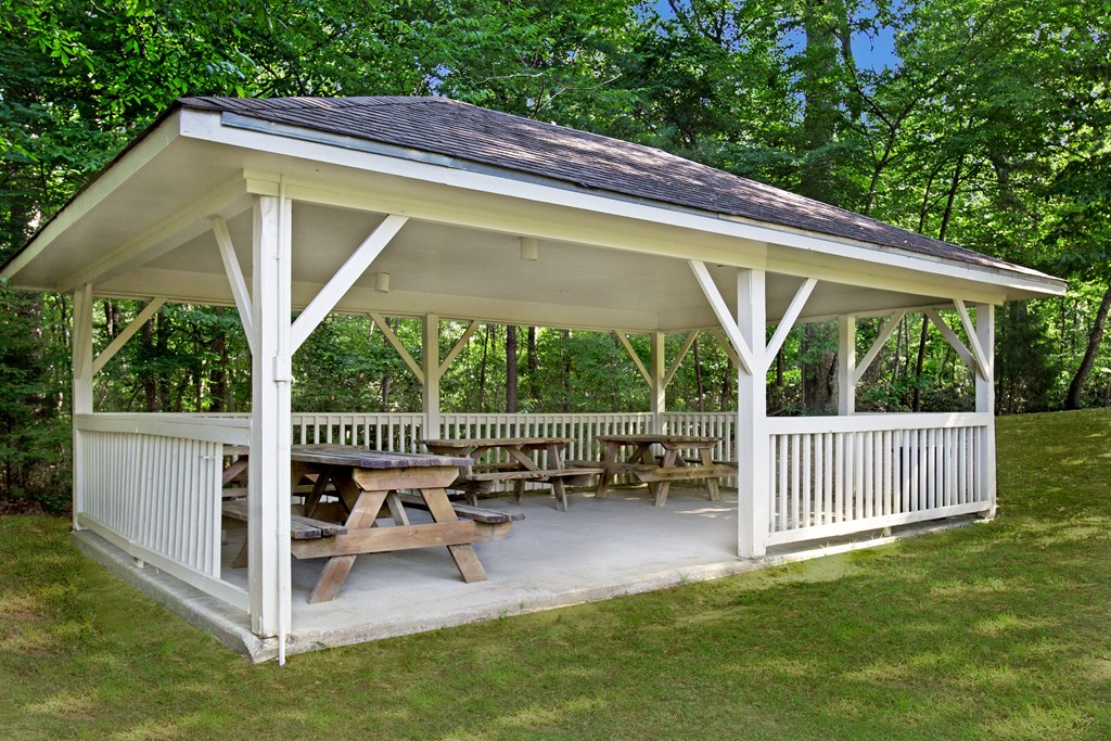 a gazebo with a picnic table on it